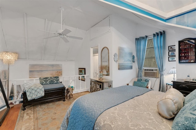 bedroom with ceiling fan, wood-type flooring, cooling unit, and high vaulted ceiling