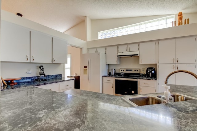 kitchen with stainless steel range with electric cooktop, sink, white cabinets, a textured ceiling, and white refrigerator with ice dispenser