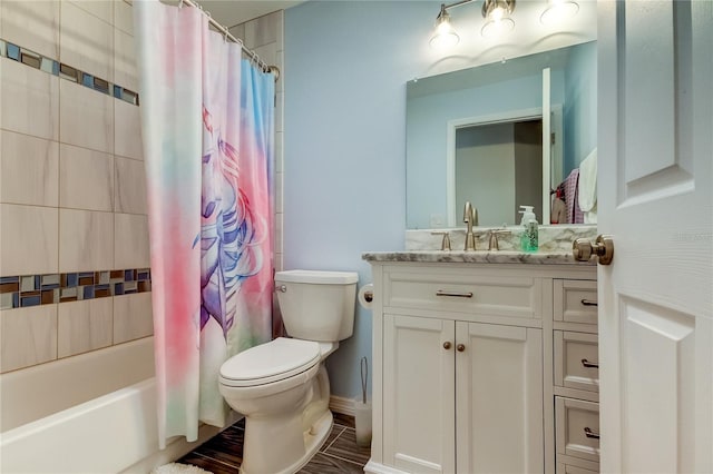 full bathroom featuring shower / bath combo with shower curtain, vanity, and toilet