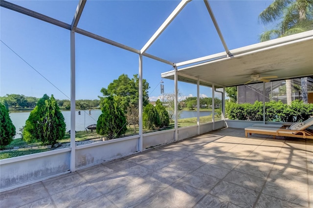 unfurnished sunroom with a water view