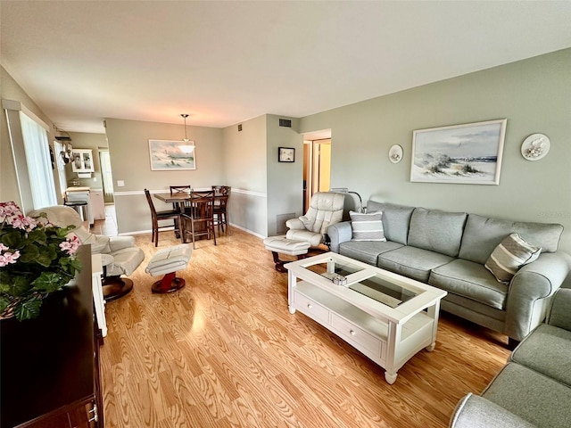 living room with light hardwood / wood-style floors