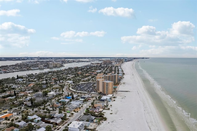 drone / aerial view with a water view and a beach view