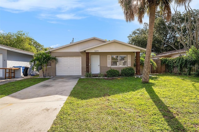 ranch-style home with a front yard and a garage