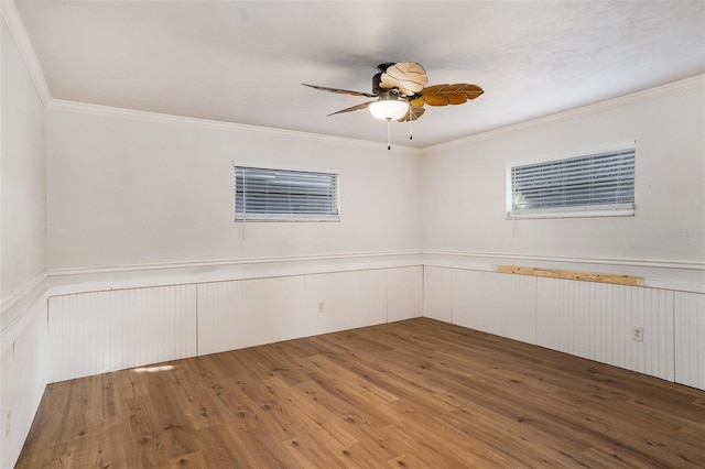 unfurnished room featuring ceiling fan, ornamental molding, and wood-type flooring