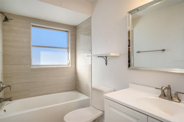 full bathroom featuring toilet, tiled shower / bath combo, and vanity