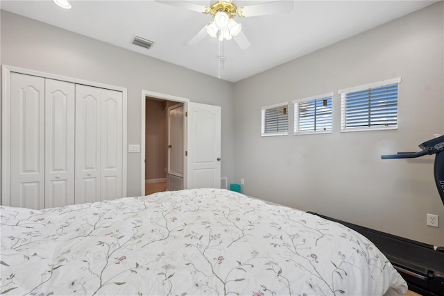 bedroom with ceiling fan and a closet