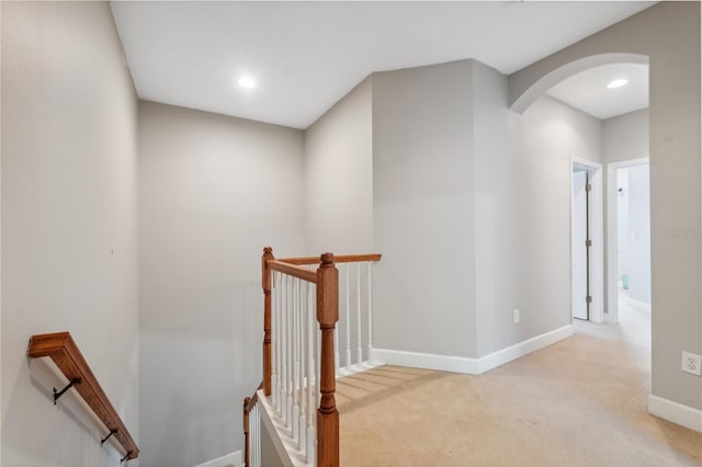 staircase with carpet floors