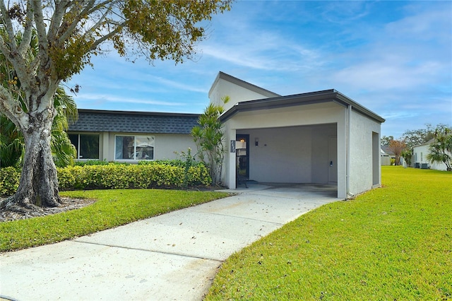 ranch-style house featuring a carport and a front yard