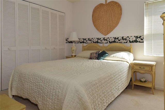 carpeted bedroom featuring a closet