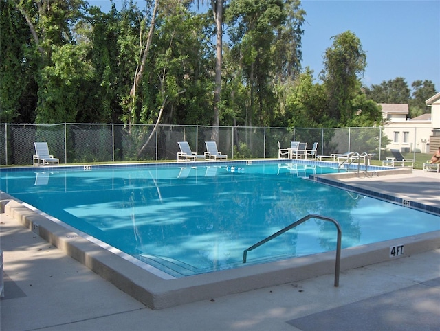 view of swimming pool featuring a patio area