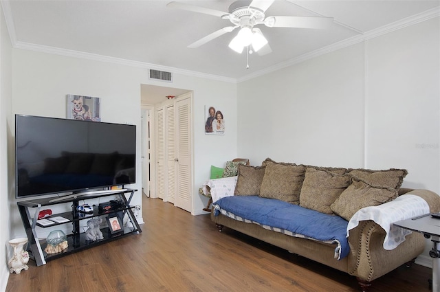 living room with ceiling fan, ornamental molding, and hardwood / wood-style flooring