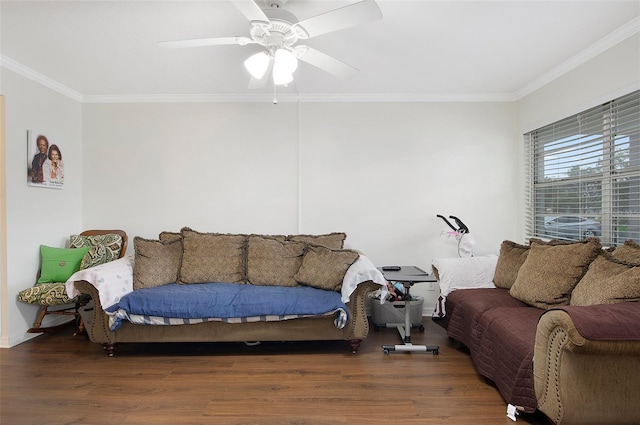 living room with dark wood-type flooring, ornamental molding, and ceiling fan