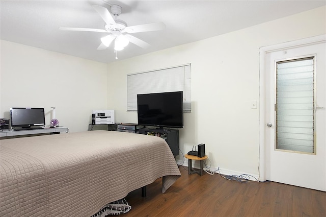 bedroom with ceiling fan and hardwood / wood-style floors