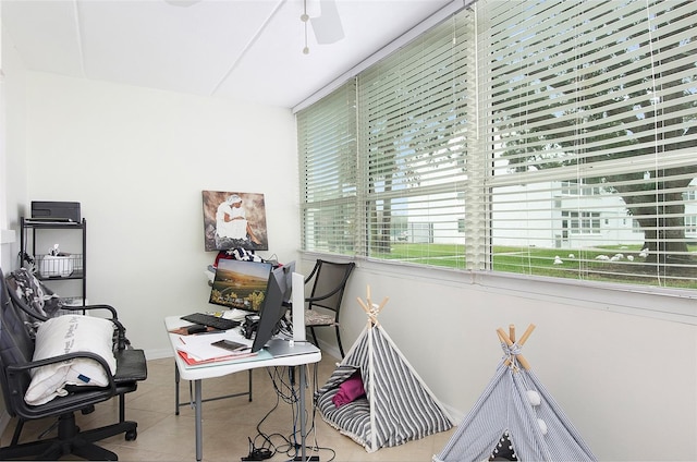 tiled home office with ceiling fan