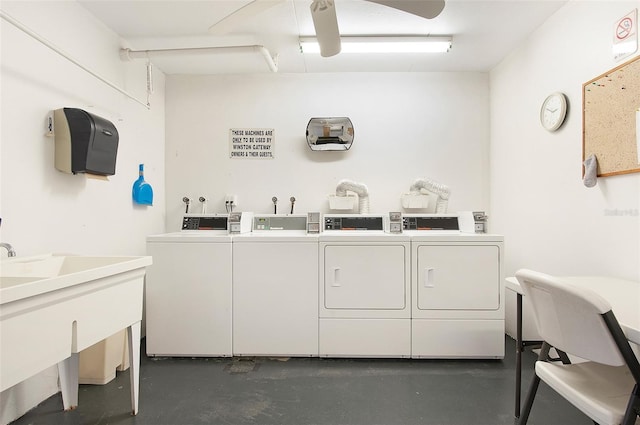 washroom featuring washing machine and clothes dryer and sink