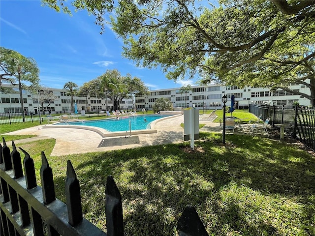 view of pool featuring a yard and a patio area