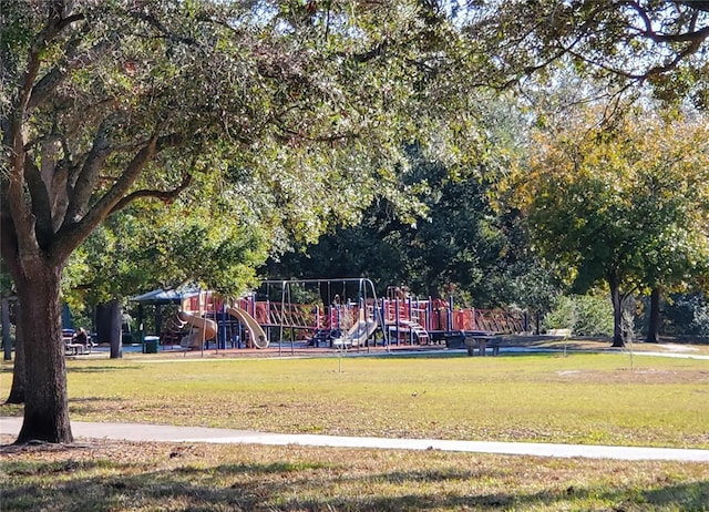 exterior space with a yard and a playground