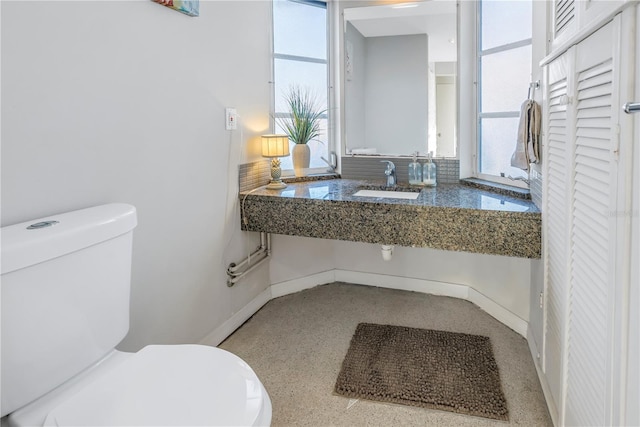 bathroom with toilet and sink