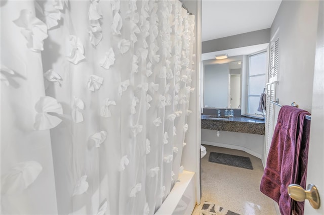 bathroom featuring shower / bathtub combination with curtain and vanity