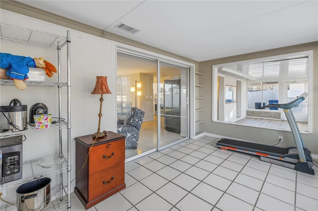 workout room with tile patterned flooring