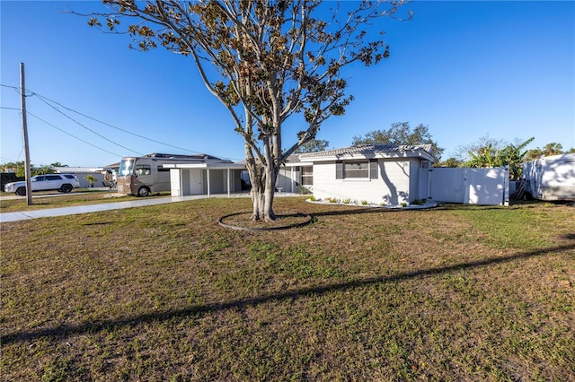 view of front of property with a front lawn