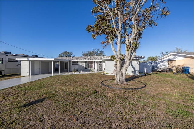 exterior space featuring a front yard and a carport