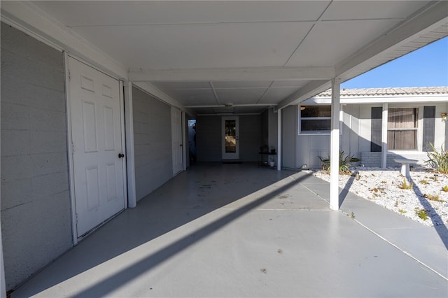 property entrance featuring a carport