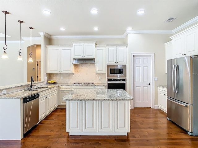 kitchen featuring white cabinets, under cabinet range hood, stainless steel appliances, and a sink