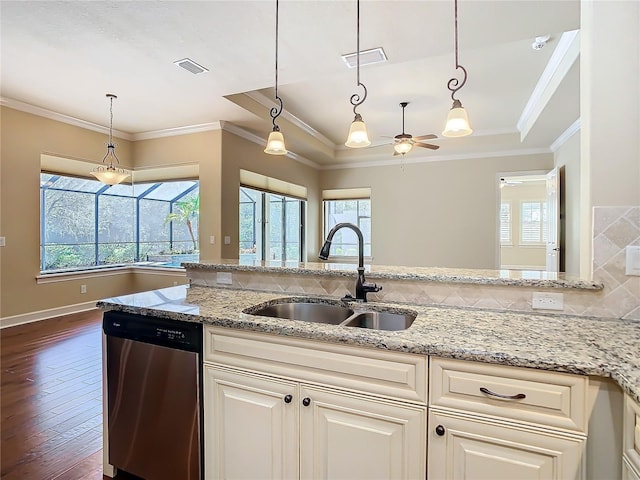 kitchen with dishwasher, ornamental molding, a sink, and visible vents