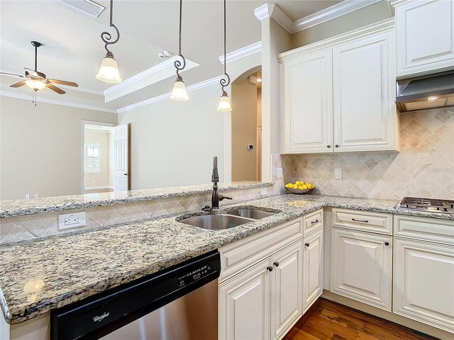 kitchen featuring visible vents, decorative backsplash, appliances with stainless steel finishes, ornamental molding, and a sink