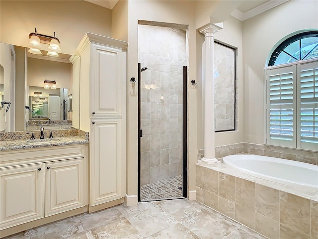 full bathroom with a bath, decorative columns, crown molding, and tiled shower