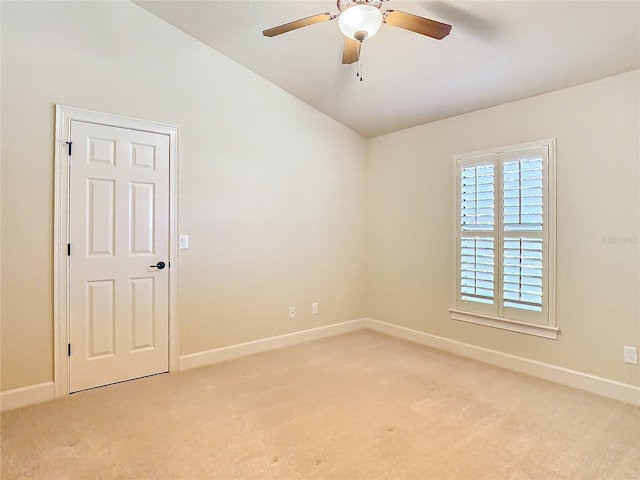 unfurnished room featuring light carpet, ceiling fan, and baseboards