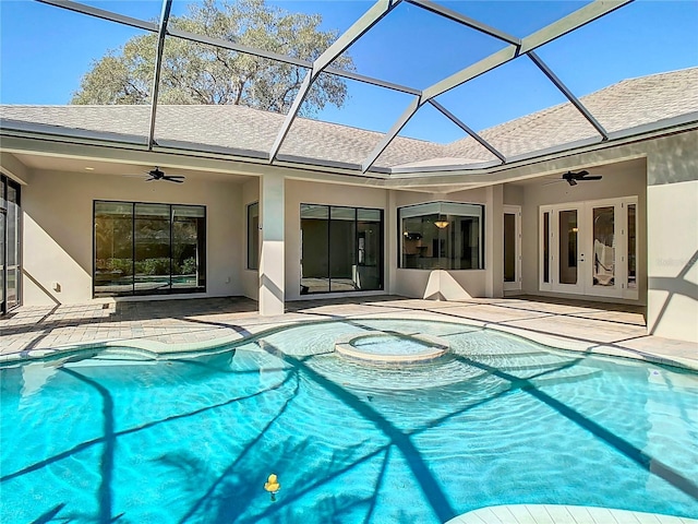 pool with a ceiling fan, a lanai, and a patio