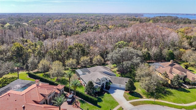 aerial view with a wooded view