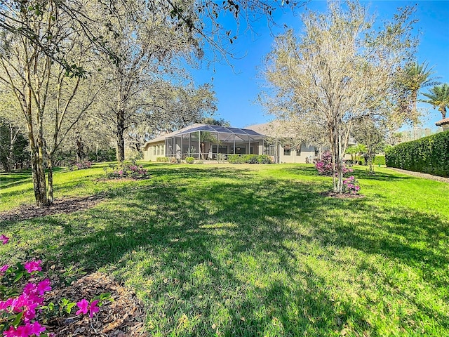 view of yard featuring a lanai