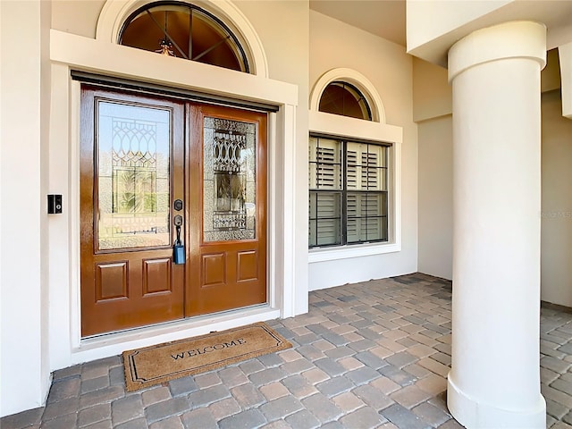 property entrance featuring stucco siding