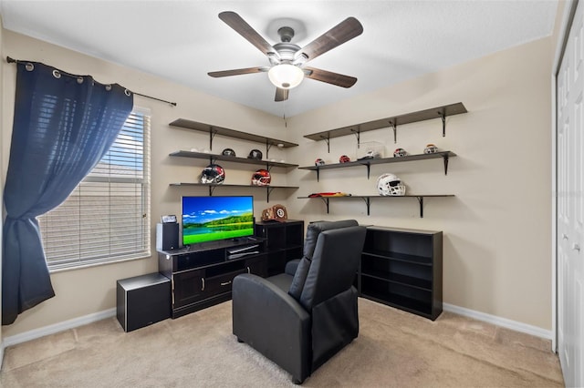 sitting room with light carpet and ceiling fan