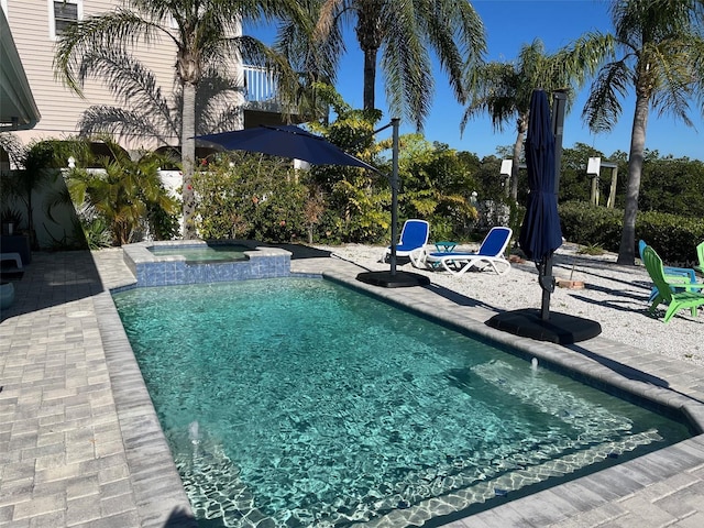 view of pool with an in ground hot tub