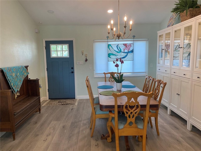 dining room featuring a chandelier and light hardwood / wood-style floors