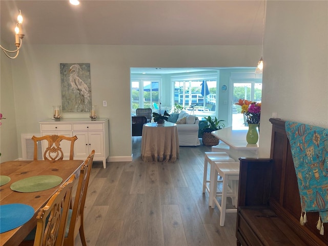 dining space with light hardwood / wood-style floors