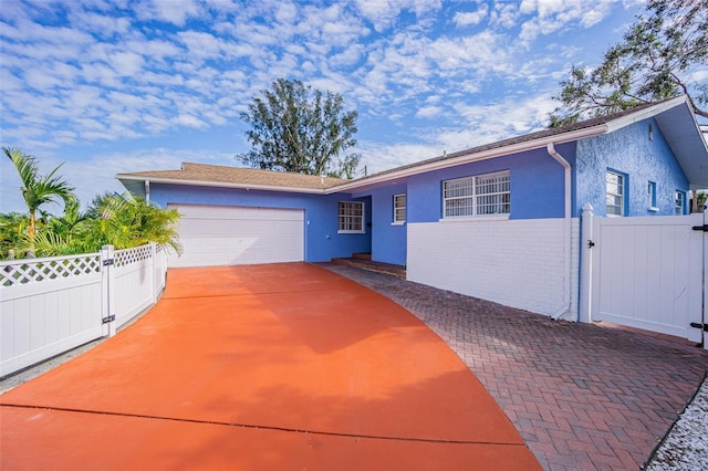 single story home with a garage