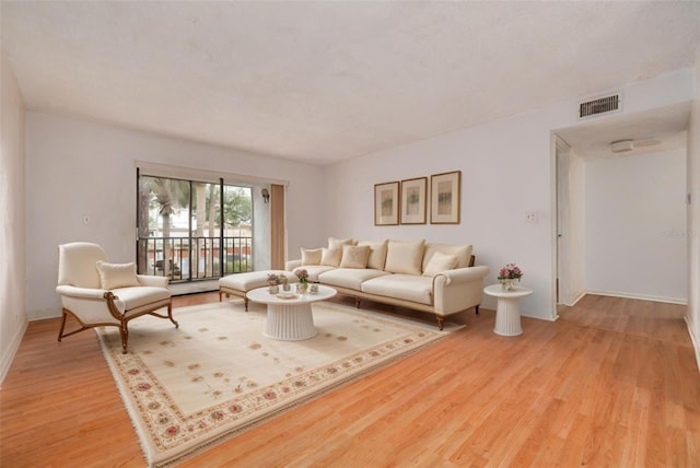 living room with light hardwood / wood-style floors