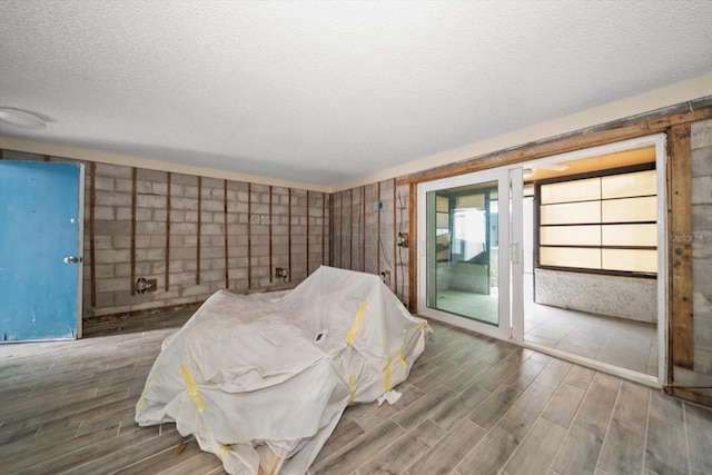 unfurnished room with a textured ceiling