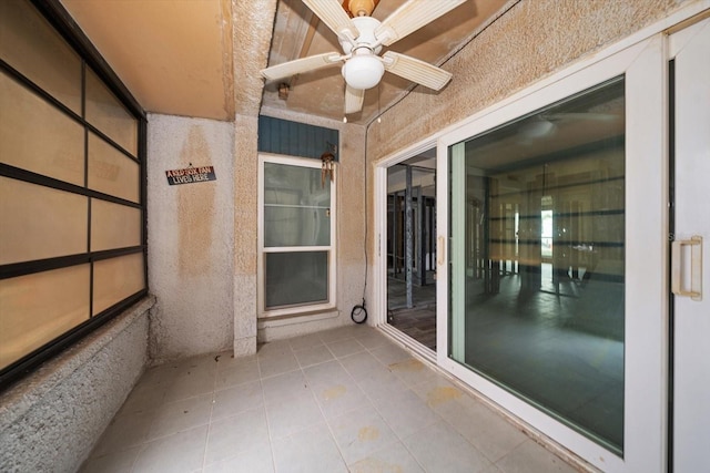 interior space featuring ceiling fan and a patio