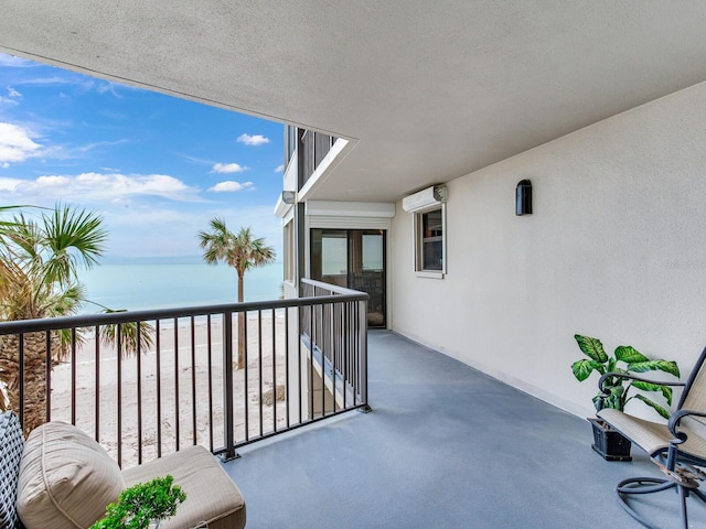 balcony featuring a water view