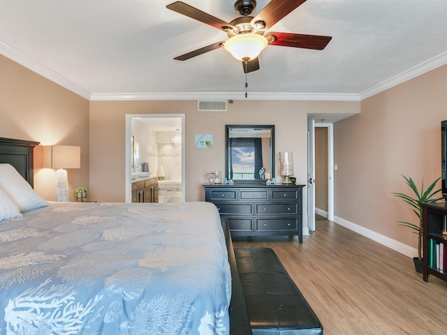 bedroom with ceiling fan, ensuite bath, wood-type flooring, and ornamental molding