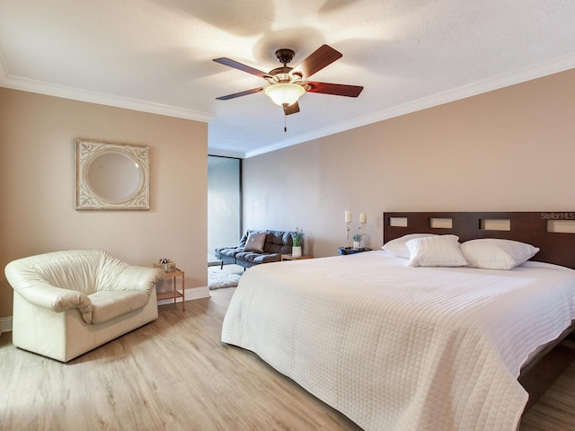 bedroom featuring ceiling fan, hardwood / wood-style floors, and ornamental molding