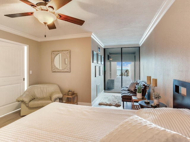 bedroom featuring ceiling fan, crown molding, hardwood / wood-style flooring, and access to outside