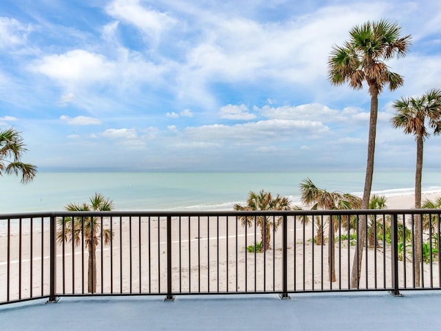 exterior space with a water view and a view of the beach