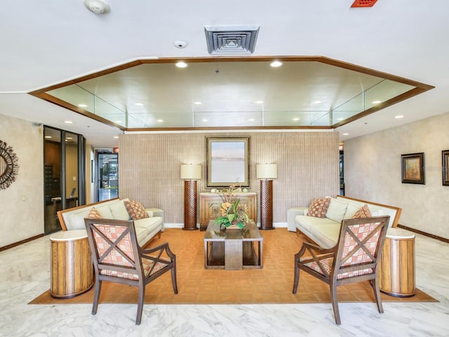 living room featuring a tray ceiling